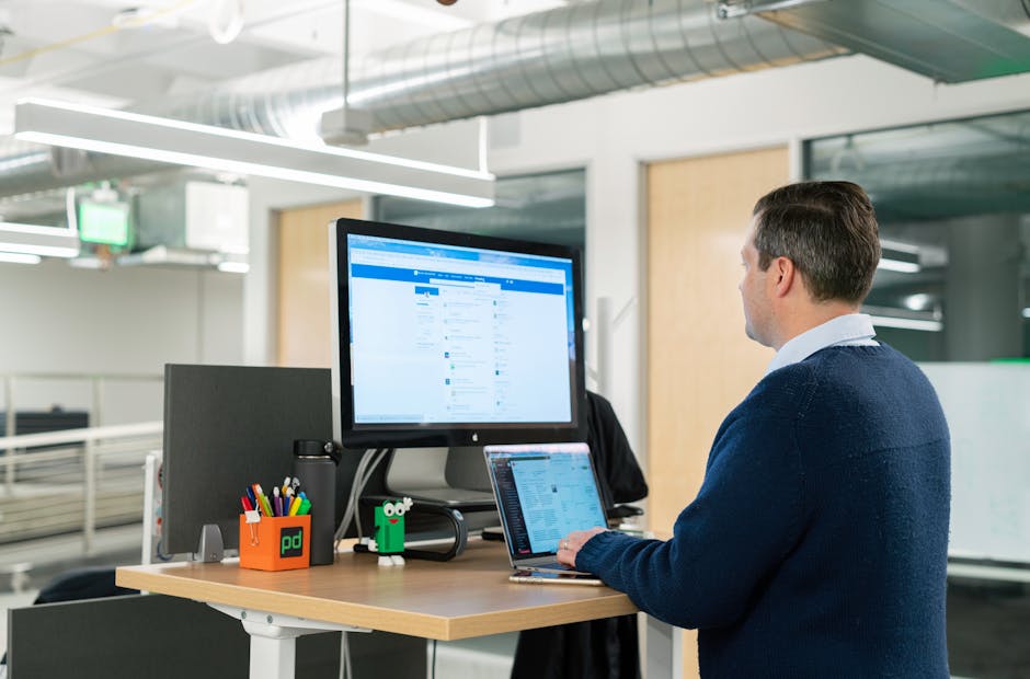 Modern ergonomic workstation with professional using cushioned desk edge, highlighting healthier setups for coders, designers, and other desk workers