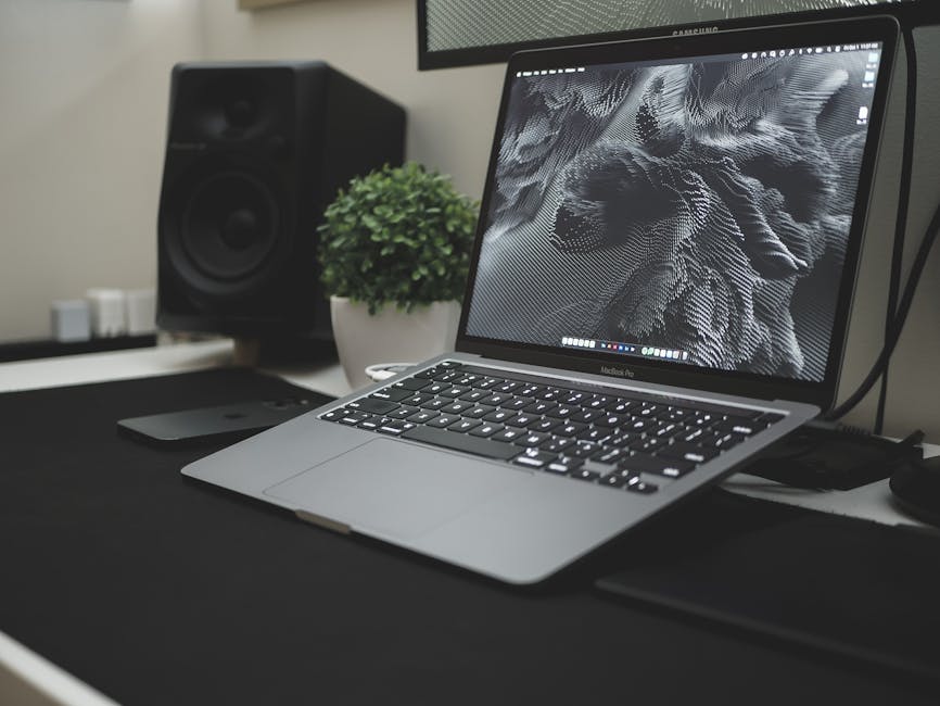 Professional laptop workspace with wrist rest, illustrating ergonomic setup and answering whether wrist support is really needed for comfort